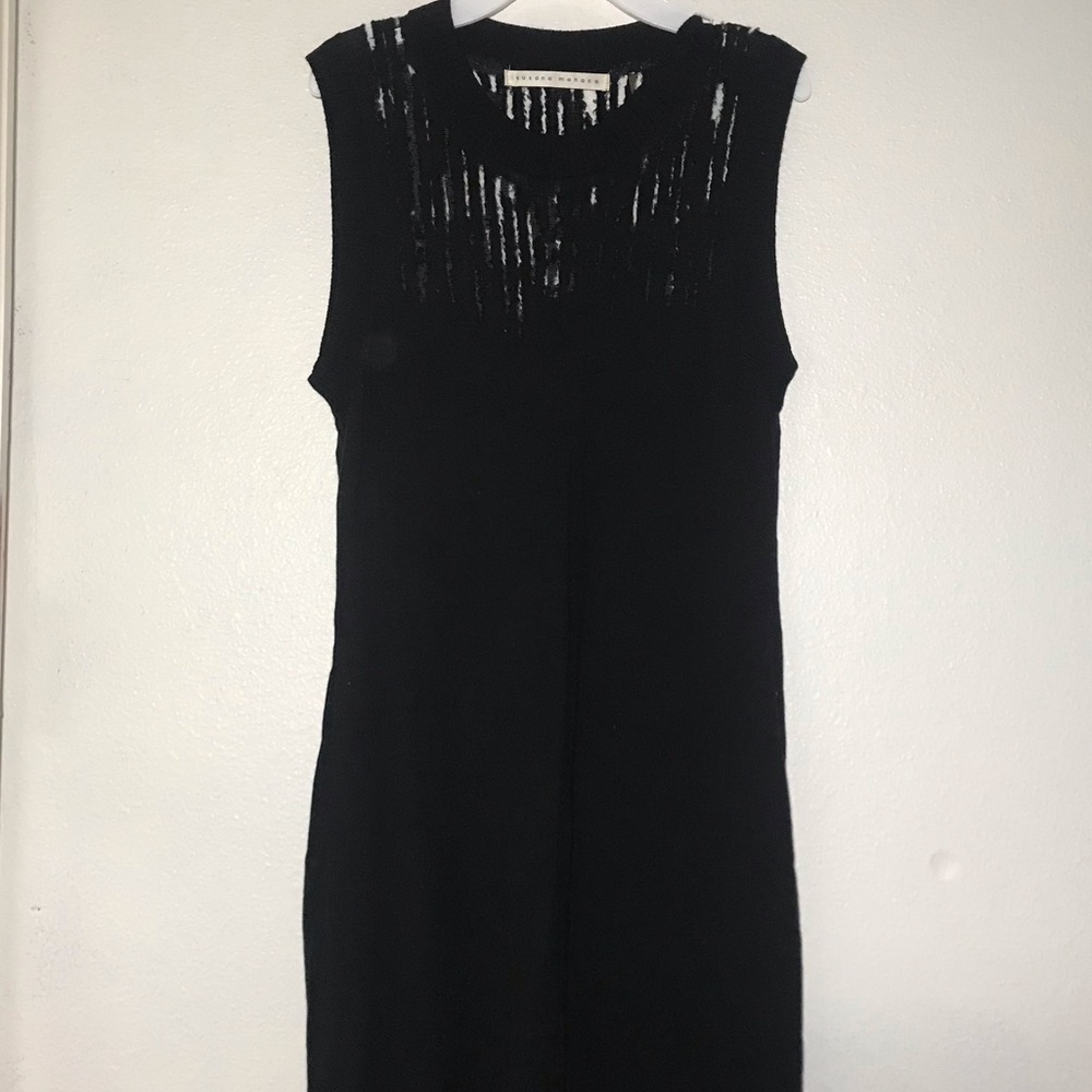 Sleeveless black wool dress.